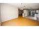 Combined dining room and kitchen layout with hardwood flooring at 302 Cello Cir, Winter Springs, FL 32708