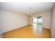 Bright dining room with sliding glass doors leading to the backyard at 302 Cello Cir, Winter Springs, FL 32708