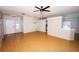 Open-concept living room featuring gleaming hardwood floors and natural light at 302 Cello Cir, Winter Springs, FL 32708