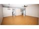 Spacious living room with hardwood floors, connecting to the kitchen at 302 Cello Cir, Winter Springs, FL 32708
