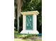 Community sign for 'The Arbors of Mt. Greenwood' surrounded by lush greenery at 302 Cello Cir, Winter Springs, FL 32708
