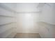 Walk-in closet features tiled floor and adjustable white wire shelving at 302 Cello Cir, Winter Springs, FL 32708