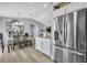 Open floor plan featuring a stainless steel refrigerator next to the dining area at 3043 Mapleshade St, Deltona, FL 32738