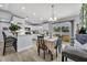 Bright dining room with modern decor and a sliding door leading to the backyard at 3043 Mapleshade St, Deltona, FL 32738