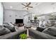 Open-concept living room featuring neutral tones, recessed lighting, and bar seating at kitchen counter at 3043 Mapleshade St, Deltona, FL 32738