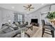 Cozy living room features modern furnishings, large windows, and an open floor plan at 3043 Mapleshade St, Deltona, FL 32738