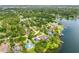 Stunning aerial view of the property nestled in a lush, lakeside community at 3102 Cecelia Dr, Apopka, FL 32703