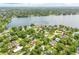 Panoramic aerial view of the lake and neighborhood with lush greenery at 3102 Cecelia Dr, Apopka, FL 32703