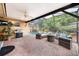 Covered patio with ceiling fan, a barbeque, and outdoor furniture overlooking the pool at 3102 Cecelia Dr, Apopka, FL 32703