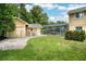 Fully fenced backyard featuring mature trees and landscaping with room to entertain at 3102 Cecelia Dr, Apopka, FL 32703