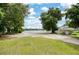 Spacious backyard with lake view, ready for landscaping and outdoor activities at 3102 Cecelia Dr, Apopka, FL 32703
