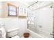 Tiled bathroom featuring a shower and tub combination and built-in storage at 3102 Cecelia Dr, Apopka, FL 32703