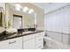 Bathroom with vanity, granite countertops, white cabinetry, and a shower-tub combo with decorative white shower curtain at 3102 Cecelia Dr, Apopka, FL 32703