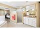 Bright bathroom featuring a shower, tub, double vanity, and neutral colored walls at 3102 Cecelia Dr, Apopka, FL 32703