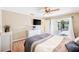Comfortable bedroom featuring sliding glass doors to the patio and a contemporary ceiling fan at 3102 Cecelia Dr, Apopka, FL 32703