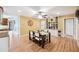 Dining room features wood floors and built-in shelves for ample storage and decorative display at 3102 Cecelia Dr, Apopka, FL 32703