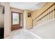 Bright foyer with tile flooring, staircase, and decorative front door at 3102 Cecelia Dr, Apopka, FL 32703