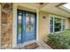 Close up of the front door with glass detailing and stone accents at 3102 Cecelia Dr, Apopka, FL 32703
