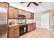 Well-equipped kitchen with wood cabinets, granite countertops, and stainless steel appliances at 3102 Cecelia Dr, Apopka, FL 32703