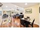 Open-concept living area with hardwood floors, vaulted ceilings, with views of the upper loft and dining area at 3102 Cecelia Dr, Apopka, FL 32703