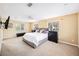 Expansive main bedroom with ample natural light, neutral carpet, and a ceiling fan for added comfort at 3102 Cecelia Dr, Apopka, FL 32703