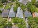 Aerial view of the property highlights its location, neighboring homes, and surrounding trees at 3223 N Orange Ave, Orlando, FL 32803