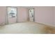 Bright bedroom with large windows and neutral carpet at 3223 N Orange Ave, Orlando, FL 32803