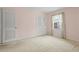 Bright bedroom with a large window, closet and neutral carpet at 3223 N Orange Ave, Orlando, FL 32803
