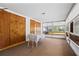 Bright dining area features many windows, a table and chairs, and neutral carpet at 3223 N Orange Ave, Orlando, FL 32803