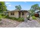 Charming home with a paved walkway, covered entry, and lush landscaping at 3223 N Orange Ave, Orlando, FL 32803