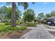 Charming home with mature trees, greenery, and a brick-paved driveway at 3223 N Orange Ave, Orlando, FL 32803
