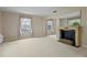 Bright living room with classic fireplace and large windows offering lots of light at 3223 N Orange Ave, Orlando, FL 32803