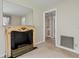 Cozy living room with elegant fireplace and doorway leading to the next room at 3223 N Orange Ave, Orlando, FL 32803