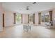 Spacious living room with tile flooring, ceiling fan and many windows at 3223 N Orange Ave, Orlando, FL 32803