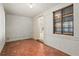 Enclosed patio featuring tiled floors, brick walls, and lots of natural light at 3223 N Orange Ave, Orlando, FL 32803