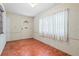 Covered patio featuring tiled floors, a door to the backyard and plenty of light at 3223 N Orange Ave, Orlando, FL 32803