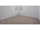 Bright bedroom with natural light from the windows and plush carpeting at 3240 Canna Lily Pl, Clermont, FL 34711