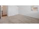 Carpeted bedroom with a closet and a window letting in natural light at 3240 Canna Lily Pl, Clermont, FL 34711