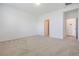 Neutral bedroom with light carpet and white walls at 3240 Canna Lily Pl, Clermont, FL 34711
