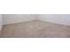 Empty bedroom with neutral carpet, white walls, and natural light at 3240 Canna Lily Pl, Clermont, FL 34711
