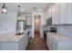 This kitchen has a large center island with stainless steel appliances at 3240 Canna Lily Pl, Clermont, FL 34711