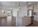 Gourmet kitchen featuring a large island, stainless steel appliances, and an open layout at 3240 Canna Lily Pl, Clermont, FL 34711