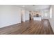 Spacious living room featuring hardwood floors, neutral paint, and bright, open space at 3240 Canna Lily Pl, Clermont, FL 34711