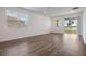 Living space with hardwood floors, neutral paint, and ample natural light at 3240 Canna Lily Pl, Clermont, FL 34711