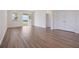 This open-concept space features hardwood floors, neutral paint, and bright, natural light at 3240 Canna Lily Pl, Clermont, FL 34711