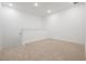 This carpeted loft area with white walls is bright and airy, perfect for a play area or second Gathering room at 3240 Canna Lily Pl, Clermont, FL 34711
