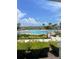 Enjoy the community pool with palm trees, landscaping, and open space at 3240 Canna Lily Pl, Clermont, FL 34711