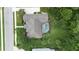 Overhead view of a backyard with a pool surrounded by a green lawn and trees at 343 Leslie Ln, Lake Mary, FL 32746