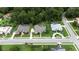 Aerial view showcases well-maintained homes with screened-in pools, lush greenery, and manicured landscapes in a desirable neighborhood at 343 Leslie Ln, Lake Mary, FL 32746