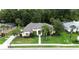 An aerial shot showcases the home's manicured lawn, landscaping, and exterior architecture at 343 Leslie Ln, Lake Mary, FL 32746